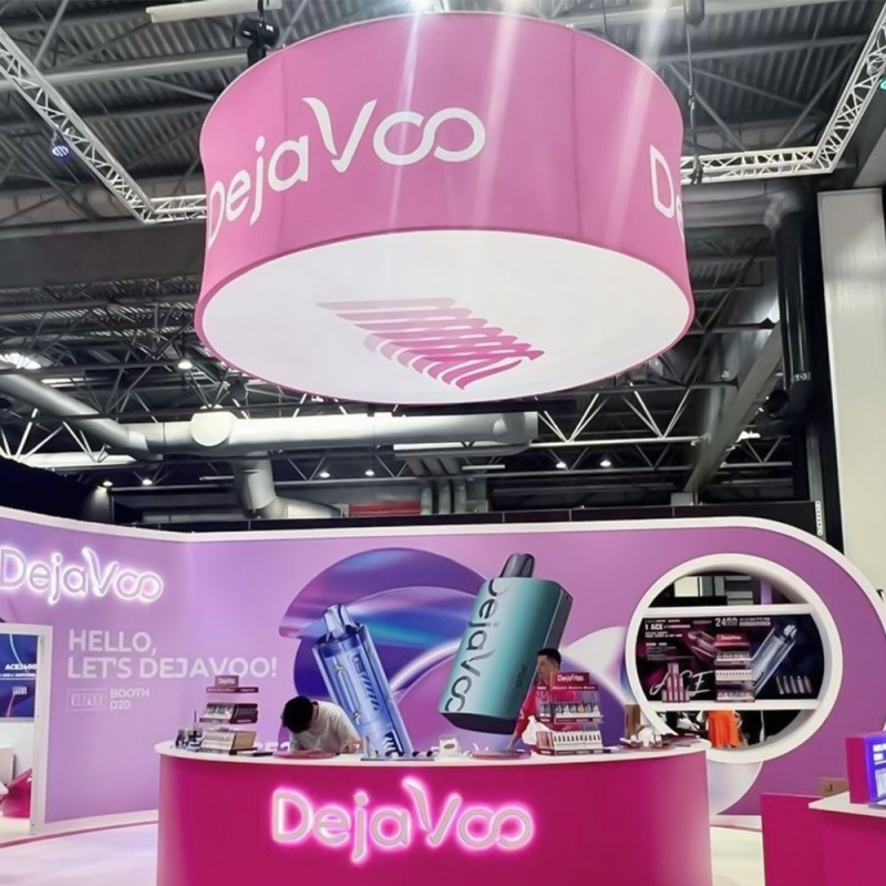 Custom printed circular tension fabric hanging banner above an exhibition stand